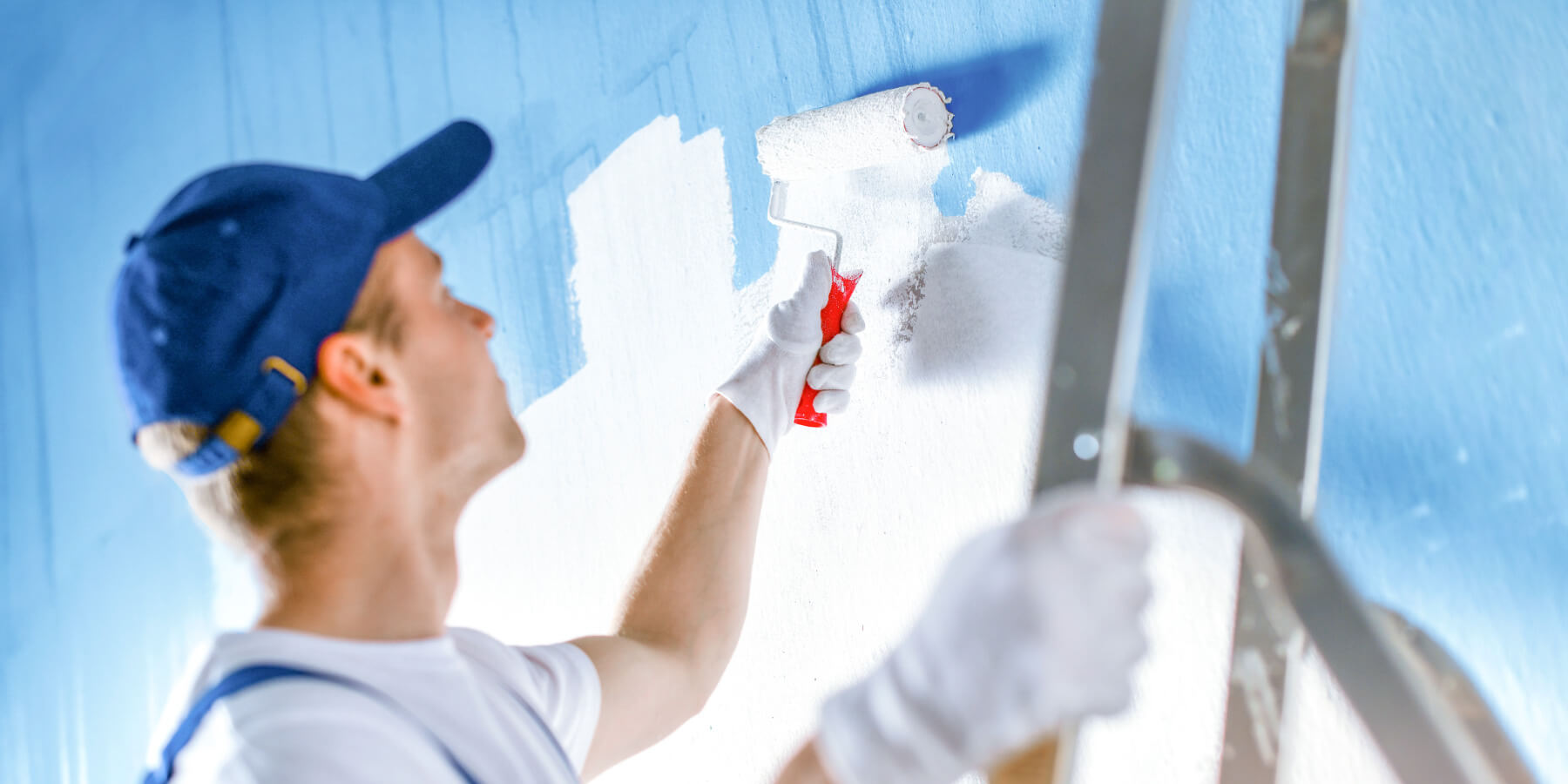 man-painting-a-wall