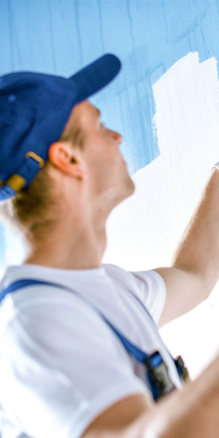 man-painting-a-wall